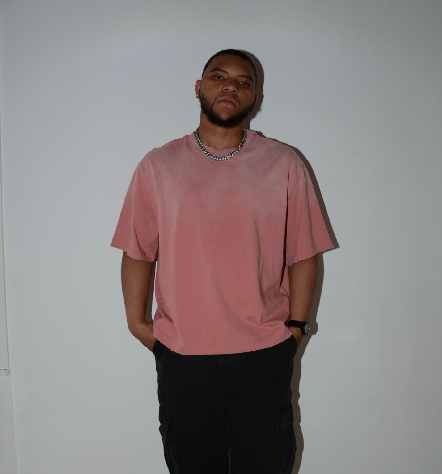 Karisse G official portrait in a pink shirt